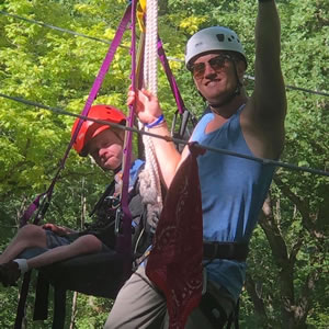 camper and counselor on the ropes course